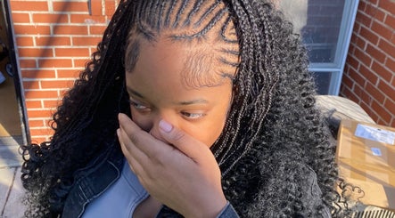 Woman with intricate braids at Dreams Vanity, Philadelphia, Pennsylvania, US showcasing hairstyling expertise.