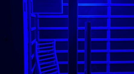 Illuminated sauna at Recover by Heat Retreat, Mount Maunganui, Bay Of Plenty Region, NZ under a blue light.