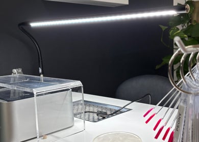 Sleek nail station at Nails.HolliKate, Gunnedah, New South Wales, AU, showcasing modern tools and vibrant nail samples.