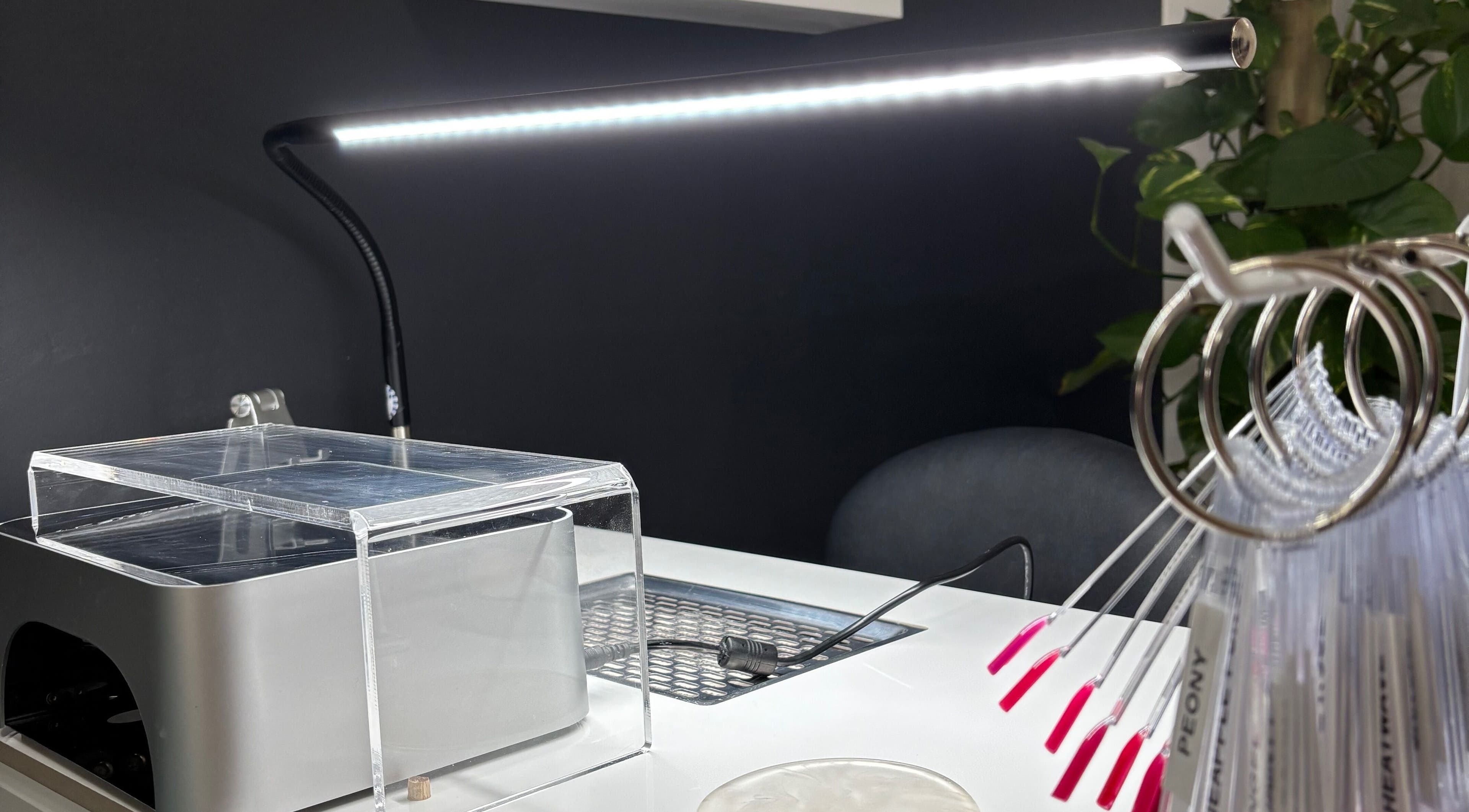 Sleek nail station at Nails.HolliKate, Gunnedah, New South Wales, AU, showcasing modern tools and vibrant nail samples.