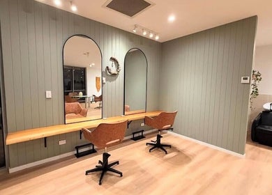 Modern interior of The Fox & Dandelion Hair Bar 🦊🌼 in Maroochydore, Queensland, AU featuring styling chairs and mirrors.
