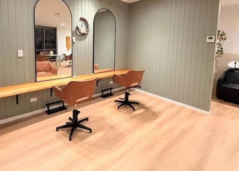 Chic styling area at The Fox & Dandelion Hair Bar, Maroochydore, Queensland, AU. Two mirrors and chairs.