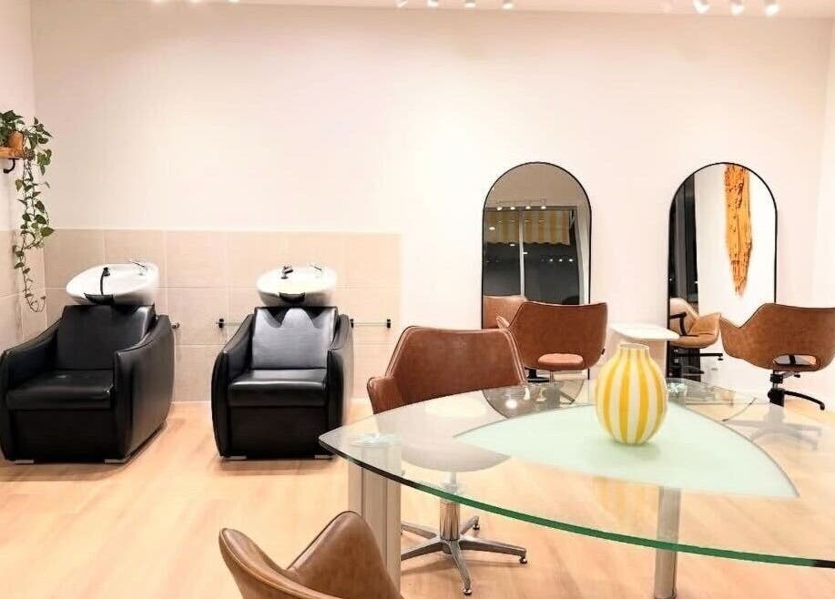 Modern salon interior at The Fox & Dandelion Hair Bar, Maroochydore, Queensland, AU with chic chairs and mirrors.