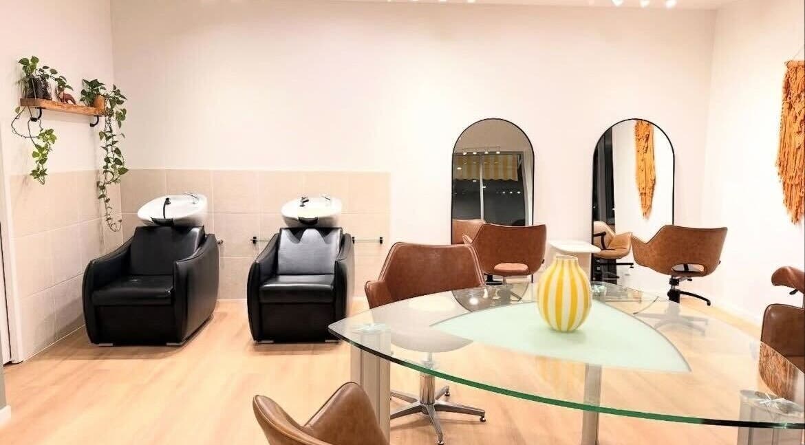 Modern salon interior at The Fox & Dandelion Hair Bar, Maroochydore, Queensland, AU with chic chairs and mirrors.