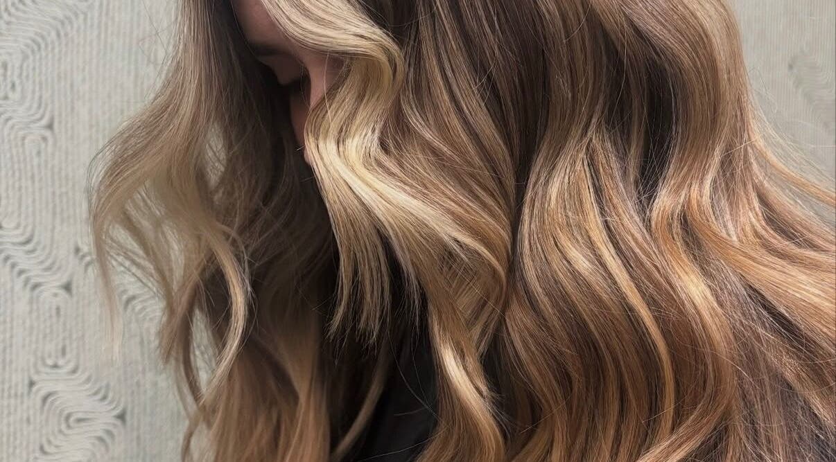 Luxurious waves in golden tones at The Fox & Dandelion Hair Bar, Maroochydore, Queensland, AU.