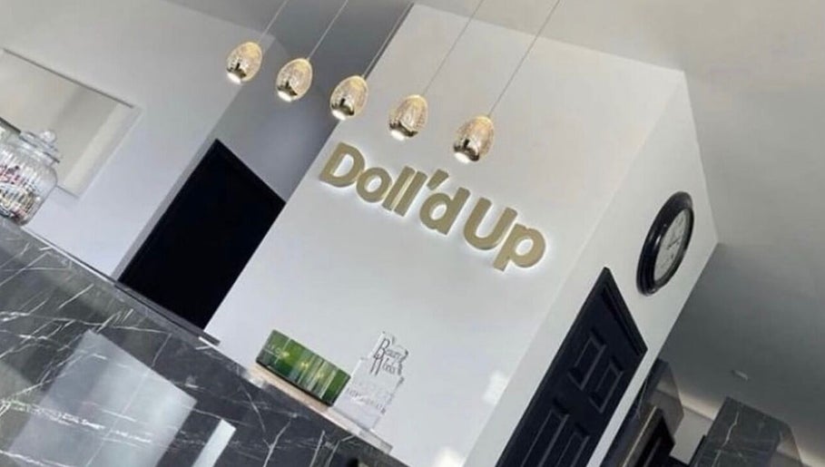 Sophisticated interior of Pmu lounge in Failsworth, England, GB with stylish decor and Doll'd Up sign.