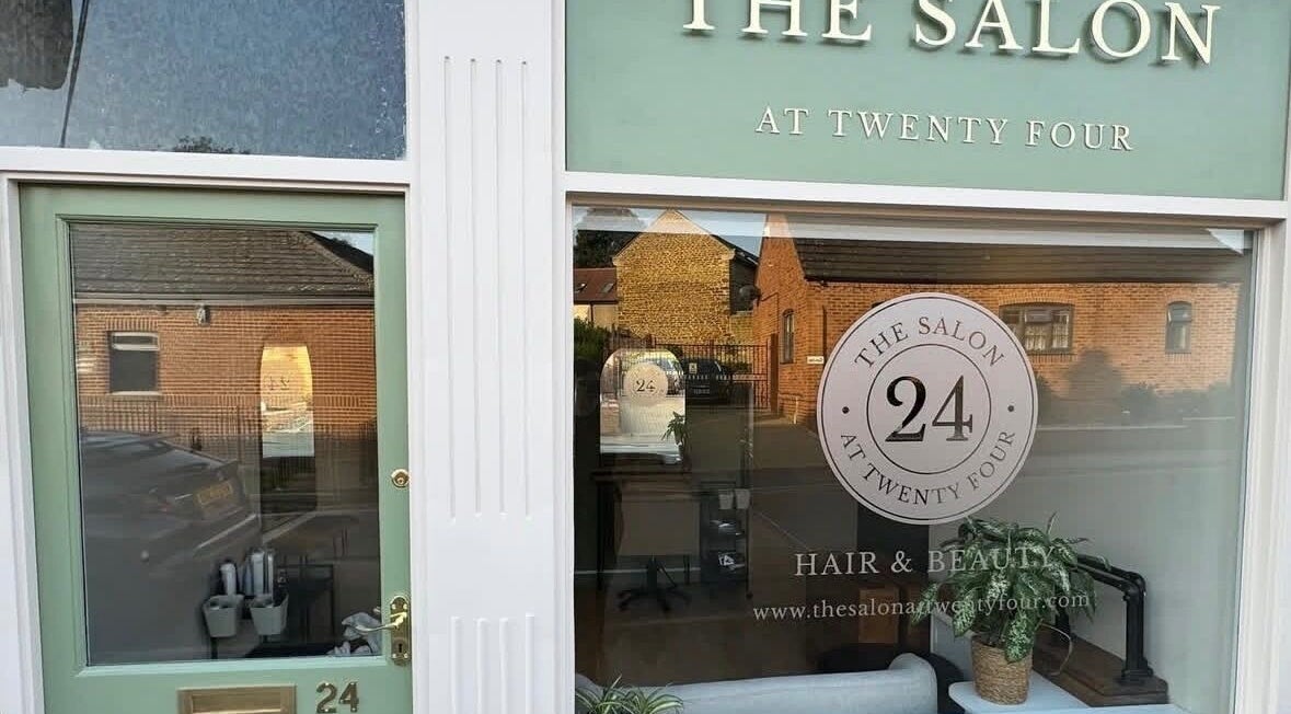 The elegant front of JLR Hairworks in Woodford Halse, England, showcasing its stylish exterior.