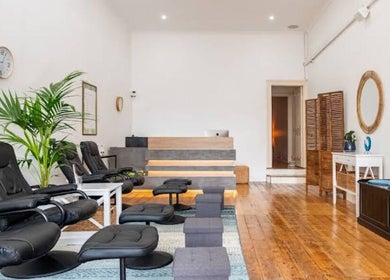 Spacious, relaxing area at Port Melbourne Thai Massage by Saijai, Melbourne, Victoria, AU with cozy black chairs.