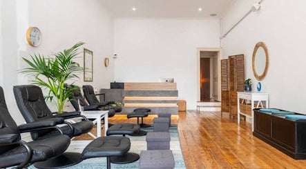 Spacious, relaxing area at Port Melbourne Thai Massage by Saijai, Melbourne, Victoria, AU with cozy black chairs.