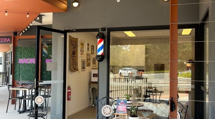 Entrance of Piccante Barbers in Peregian Springs, Queensland, AU showcasing stylish decor.