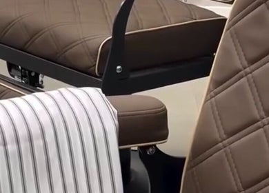 Luxurious barber chair at Piccante Barbers, Peregian Springs, Queensland, AU with striped cape.
