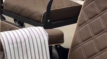 Luxurious barber chair at Piccante Barbers, Peregian Springs, Queensland, AU with striped cape.