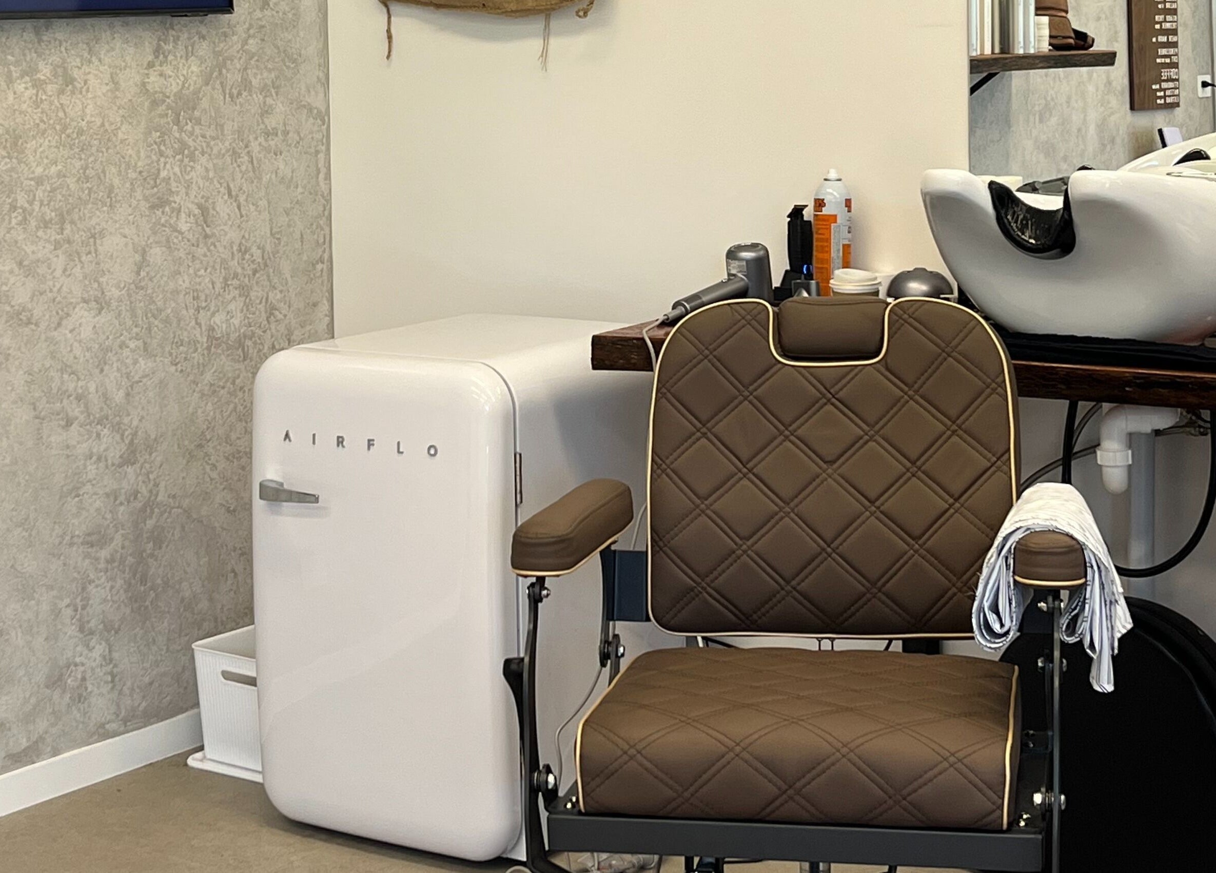 Modern barber chair and washbasin at Piccante Barbers, Peregian Springs, Queensland, AU.
