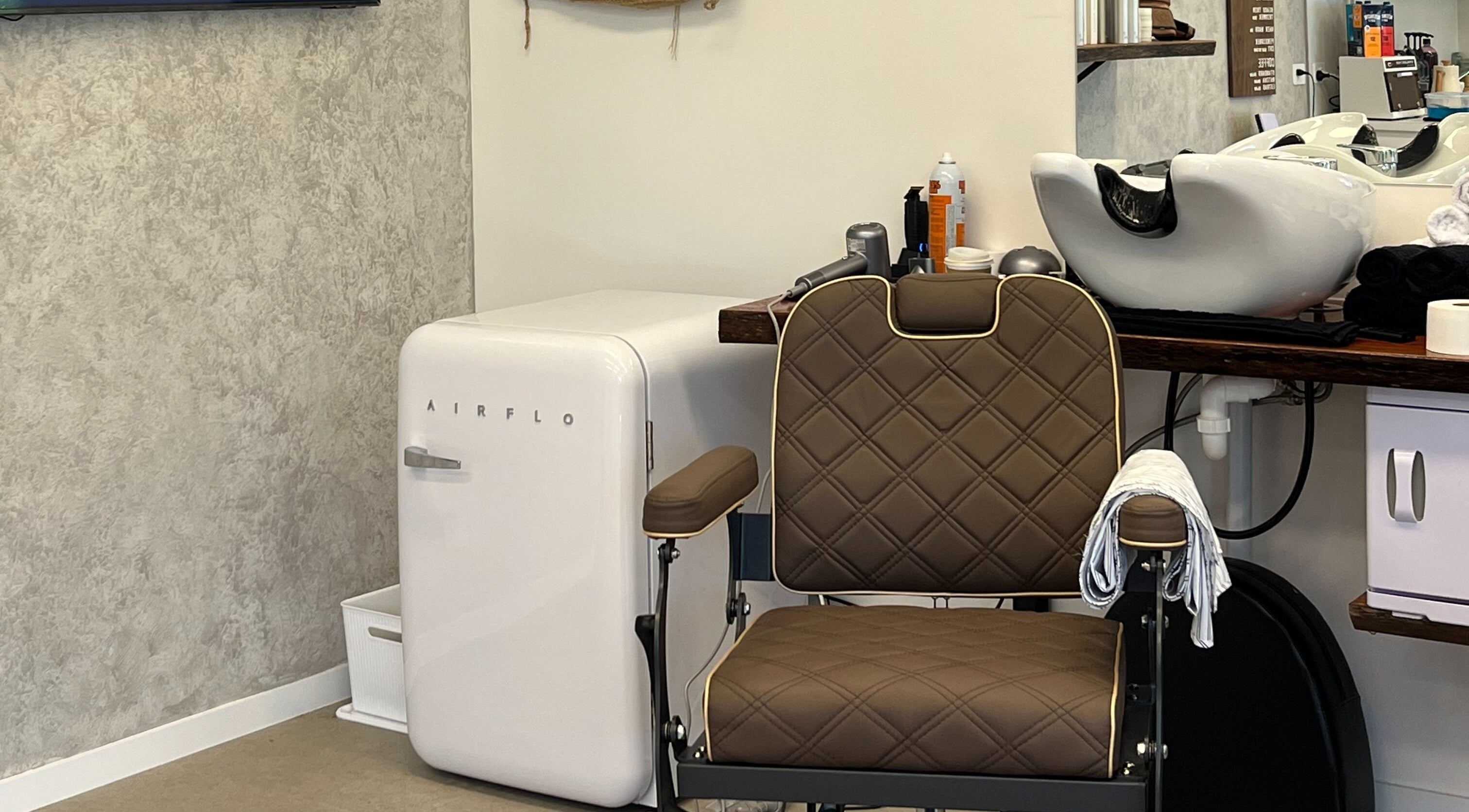 Modern barber chair and washbasin at Piccante Barbers, Peregian Springs, Queensland, AU.