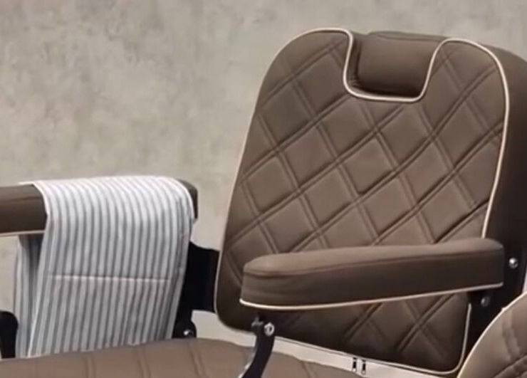 Luxurious barber chair at Piccante Barbers, Peregian Springs, Queensland, AU, exudes style and comfort.