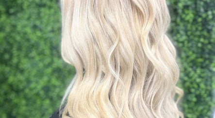 Glowing blonde waves hairstyle at The Dolls Lounge, Leeds, England, GB.