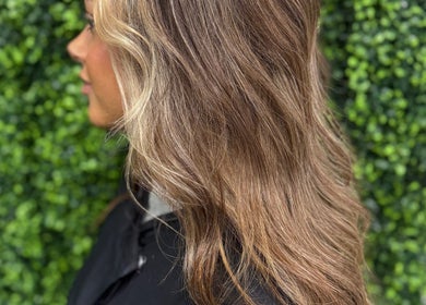 Rich brunette hair with golden highlights at The Dolls Lounge, Leeds, England, GB.