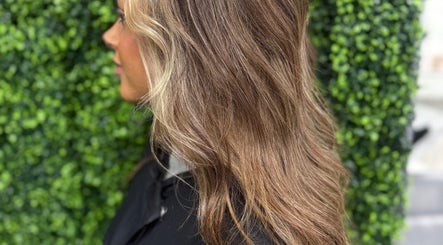 Rich brunette hair with golden highlights at The Dolls Lounge, Leeds, England, GB.
