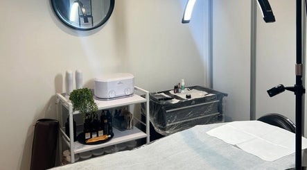 Treatment room at Forever Grace Cosmetic Studio in Pegasus, Canterbury Region, NZ, featuring a cozy, professional setup.