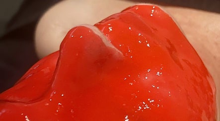 Close-up of vibrant red treatment at Forever Grace Cosmetic Studio, Pegasus, Canterbury Region, NZ.