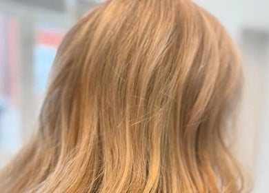 Golden blonde hair styled at LaNora Hair Studio, Crawley, England, GB, showcasing sleek, healthy strands.