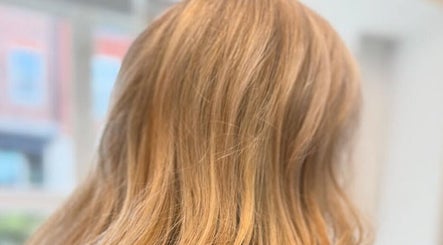 Golden blonde hair styled at LaNora Hair Studio, Crawley, England, GB, showcasing sleek, healthy strands.