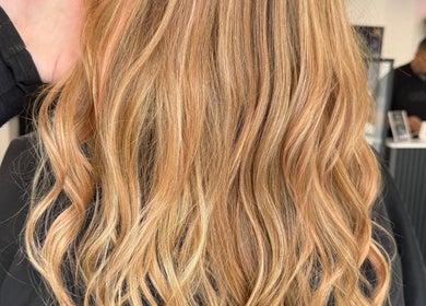 Blonde wavy hair styled at LaNora Hair Studio, Crawley, England, GB, showcasing professional hair services.