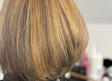 Close-up of a freshly styled bob haircut with golden highlights at LaNora Hair Studio, Crawley, England, GB.