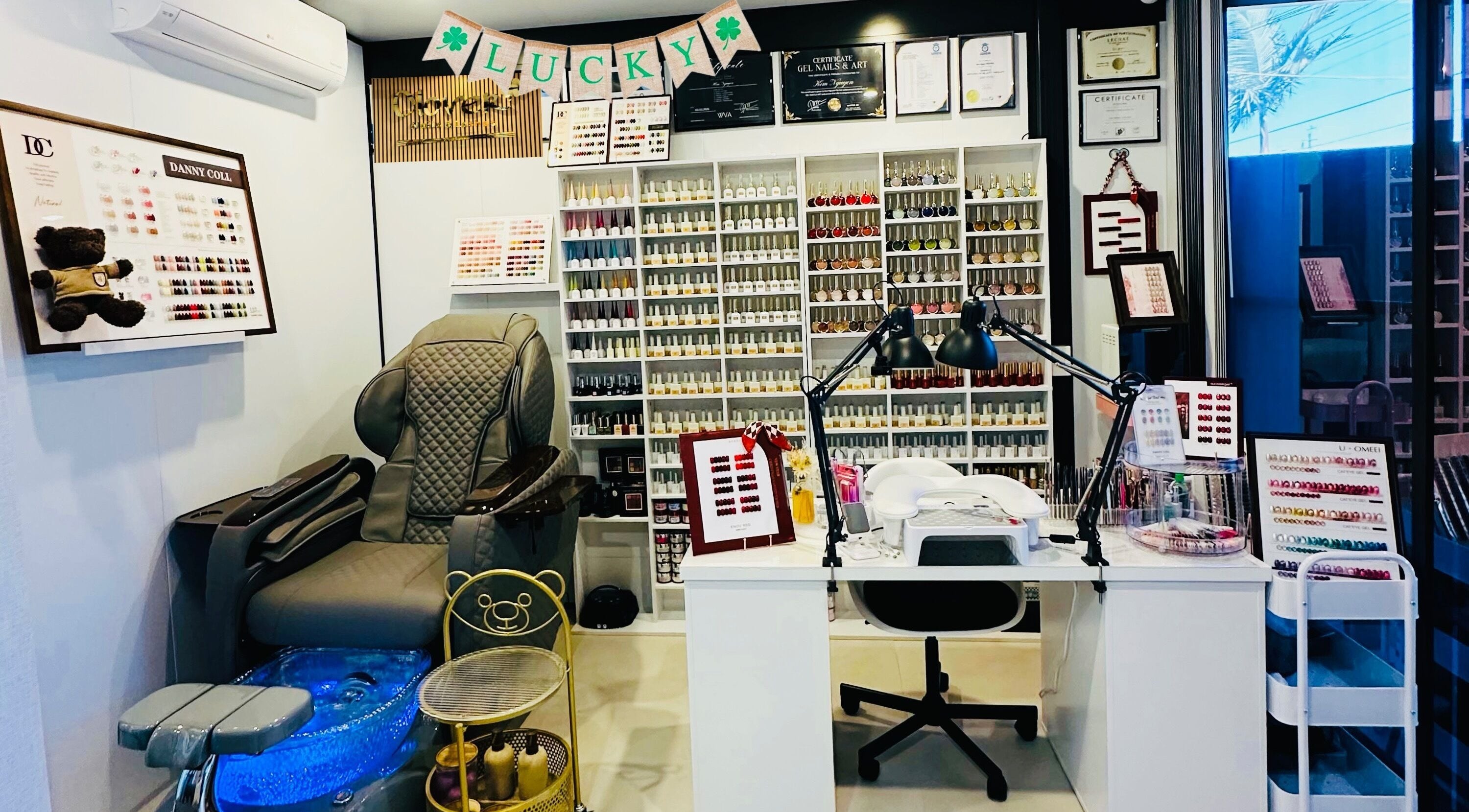 Clover Nails Lashes salon in Warwick Farm, New South Wales, AU, showcasing nail polish display and manicure station.