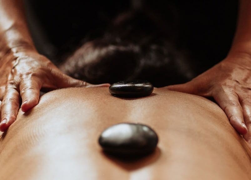 Hot stone massage at The Holistic Approach and Retreats, Ipswich, England, GB promoting relaxation and well-being.