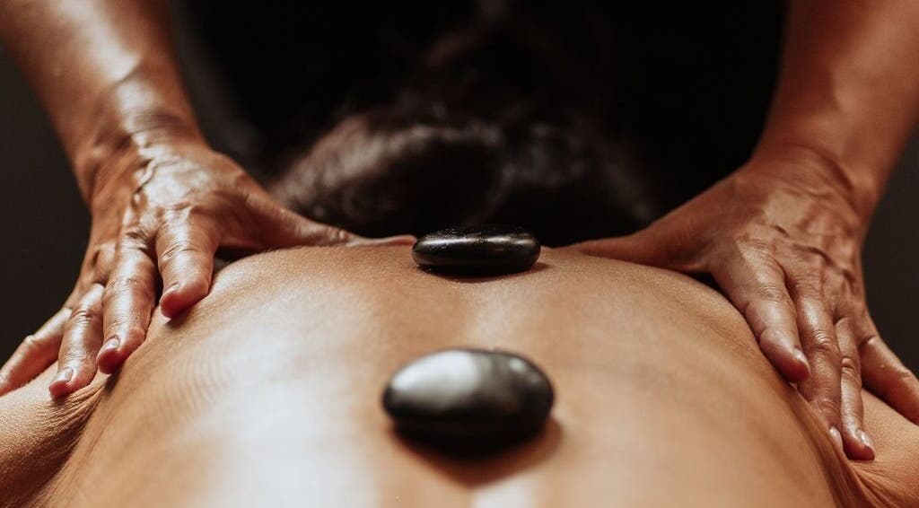 Hot stone massage at The Holistic Approach and Retreats, Ipswich, England, GB promoting relaxation and well-being.