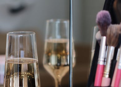 Makeup brushes and champagne glasses at Blow Garden, West Malling, England, GB, showcasing elegance and style.