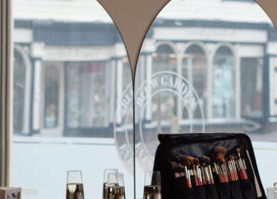 Blow Garden makeup setup with brushes and glasses in West Malling, England, GB.