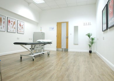 Spacious treatment room at Walk 2 Recovery Clinic, Patchway, England, GB, with comfortable massage table.