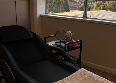 Relaxing treatment room at Studio S By Sienna, Stoke-on-Trent, England, GB, with a view of the cityscape.