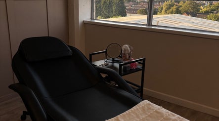 Relaxing treatment room at Studio S By Sienna, Stoke-on-Trent, England, GB, with a view of the cityscape.