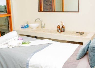 Relaxing massage room at Vygenhoek Spa & Farmhouse, Dullstroom, Mpumalanga, ZA with cozy setup and nature view.