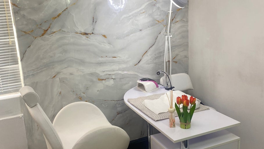 Elegant nail treatment area at Mashobalee Spa Lounge, Sandton, Gauteng, ZA with modern decor and tulip accents.