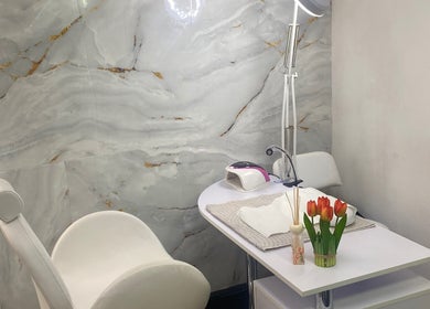 Elegant nail treatment area at Mashobalee Spa Lounge, Sandton, Gauteng, ZA with modern decor and tulip accents.