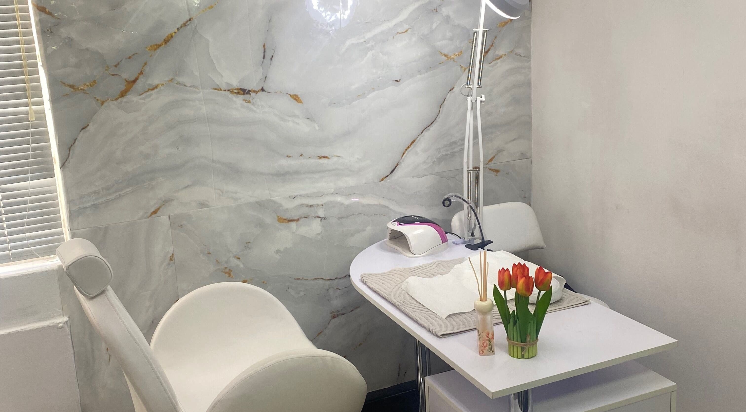 Elegant nail treatment area at Mashobalee Spa Lounge, Sandton, Gauteng, ZA with modern decor and tulip accents.