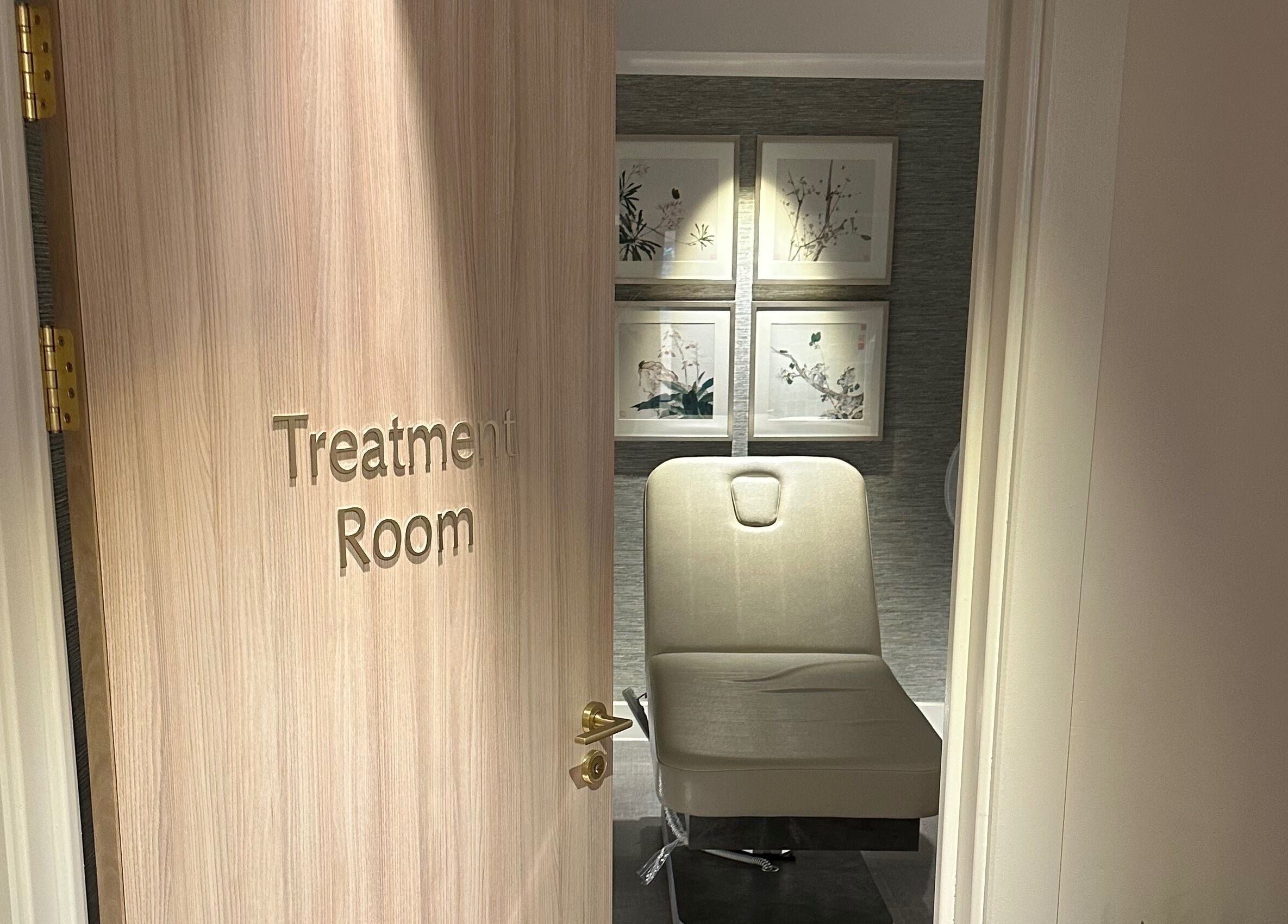 Reflex Harmony treatment room in Cirencester, England, GB showing a cozy chair and calming decor.