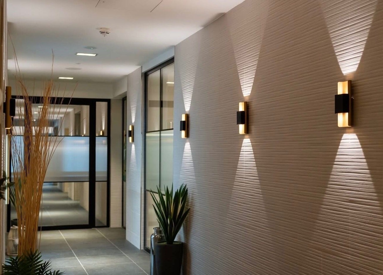 Elegant hallway at Reflex Harmony, Cirencester, England, GB, showcasing modern lighting and decor.