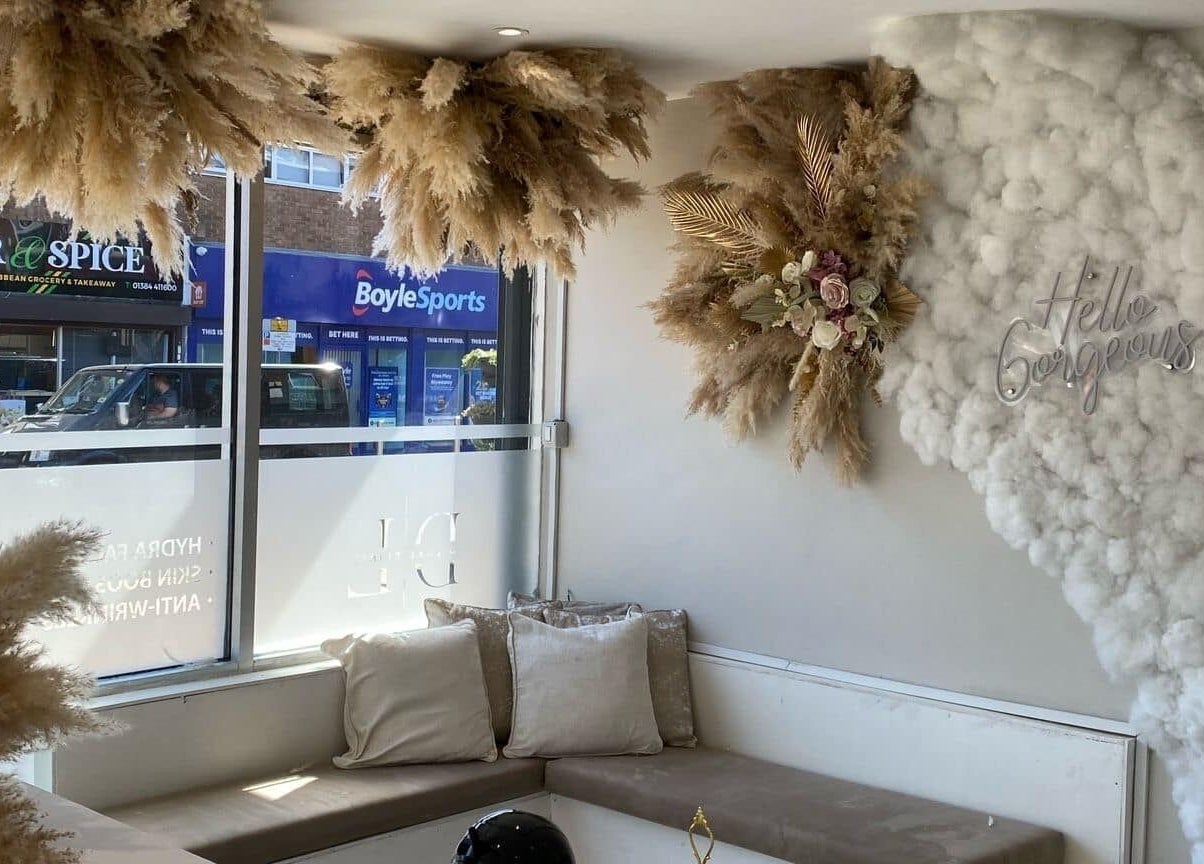 Chic interior at BareBeauty.ByKels in Cradley Heath, England, GB with plush seating and floral decor.
