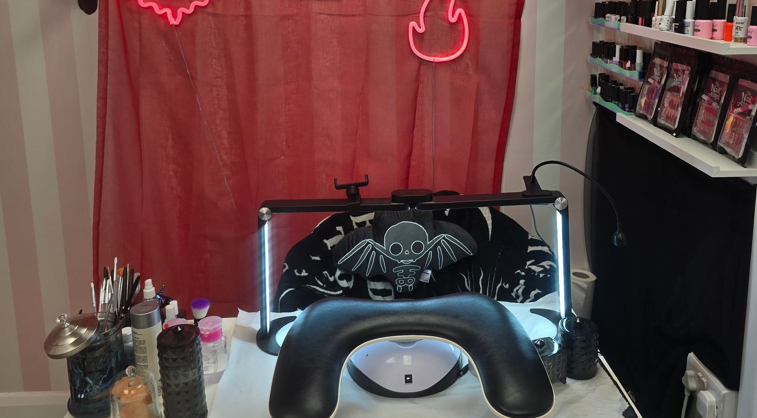 Nail salon workspace at The Nail Angel, featuring tools and neon decor in Bingley, England, GB.