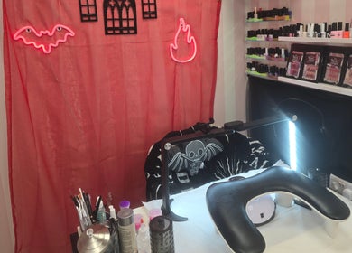 Cozy nail station at The Nail Angel in Bingley, England, GB adorned with vibrant decor and nail polish.
