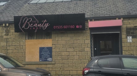 The Nail Angel exterior, elegant facade in Bingley, England, GB, sign in pink and black.