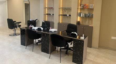 The Beauty Lab in Ħal Qormi, MT features a modern, stylish manicure station with sleek chairs and elegant decor.