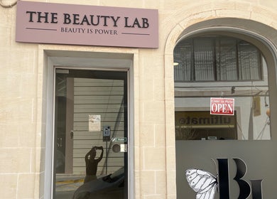 Entrance of The Beauty Lab in Ħal Qormi, MT with open sign displayed.
