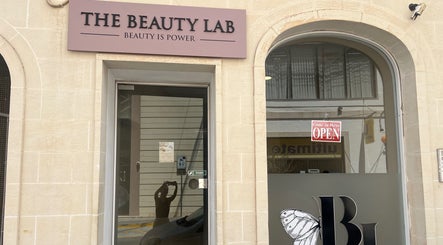 Entrance of The Beauty Lab in Ħal Qormi, MT with open sign displayed.