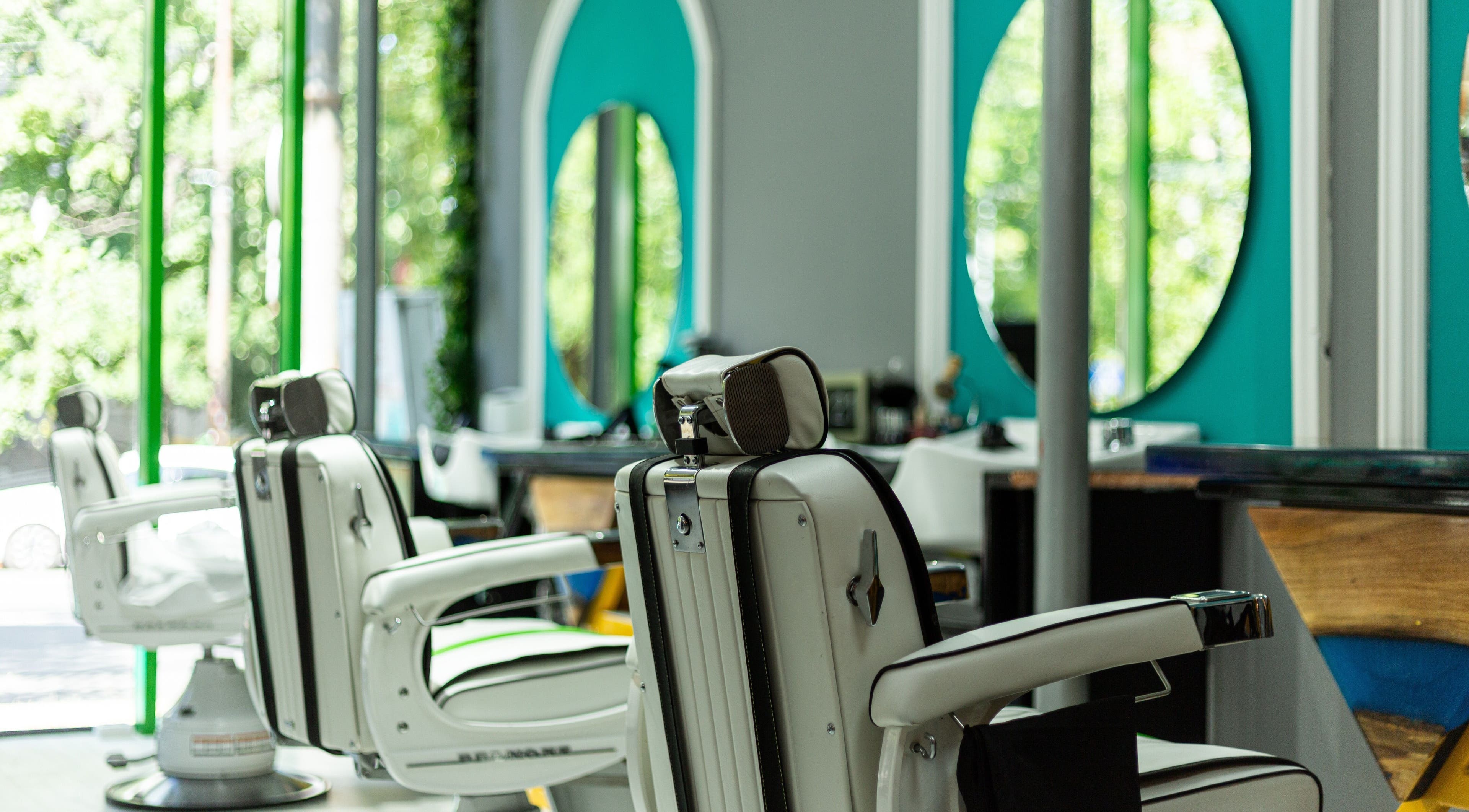 Stylish salon interior of 3rd Generation London in Timișoara, Județul Timiș, RO with modern barber chairs.
